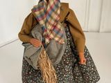 a figurine of a woman with a scarf on her head