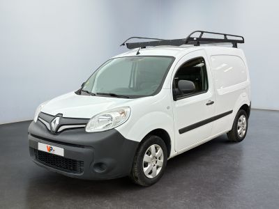 the white van is parked in a room with a black floor