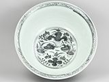 an image of a white and black plate with birds and flowers on it
