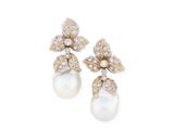a pair of pearl and diamond earrings