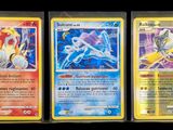 three different pokemon cards are displayed on a black background