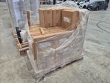 a pallet full of boxes sitting on a pallet in a parking lot