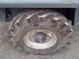 a large tire on the back of a truck