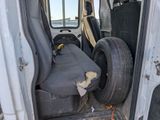 a seat in the back of a truck that has been vandalized