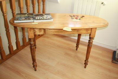 a wooden table with a book on top of it