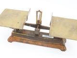 an old scale with a metal plate on it