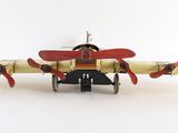 a toy airplane that is sitting on a white surface