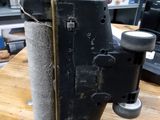 a machine that is sitting on top of a wooden table