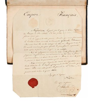 une feuille de papier sur laquelle est apposé un cachet de cire