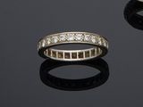 two diamond - set rings and a diamond - set ring