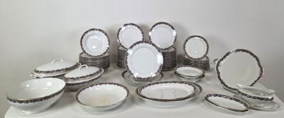a lot of plates and bowls sitting on a table