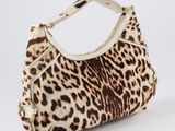 leopard print handbag on a white background