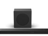 une barre de son noire posée sur une surface blanche