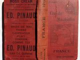 two old books that are sitting on a table