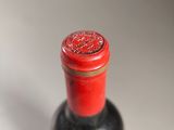 a bottle of wine that is sitting on a table