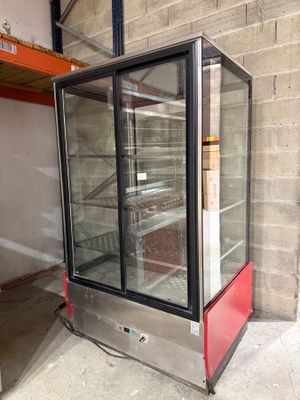 an image of a refrigerator with a glass door in a building