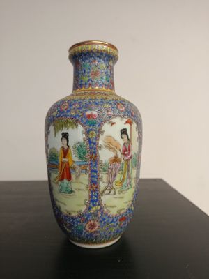 a vase that is sitting on a table on a table