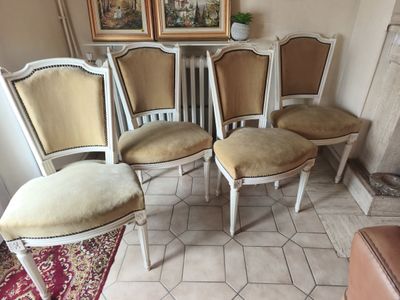 four chairs that are sitting next to each other