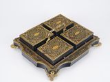 a black and gold box with a cross on it