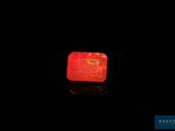 an image of a glowing red stone on a black surface