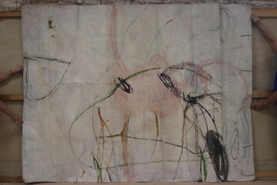 someone is drawing a picture of a horse on a piece of paper