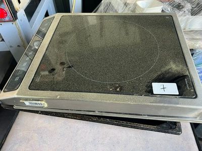 a stove top with a burner on top of it