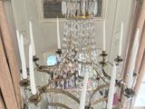 a chandelier that is hanging from the ceiling in the room
