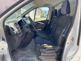 the interior of a car with the door open and the driver ' s seat down