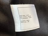 a close up of a label on a black jacket