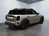 the mini countryman is parked in a large room with a white wall