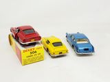 three toy cars that are sitting next to each other