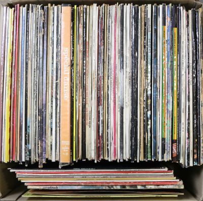 an open box filled with lots of different colored vinyl records