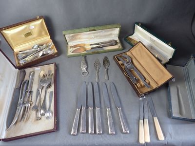 many different types of silverware on a table