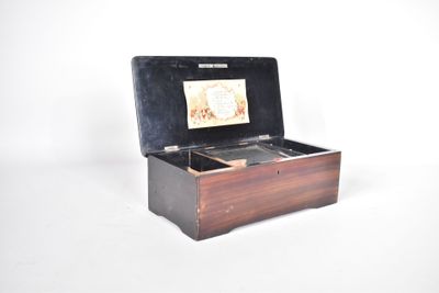 a small wooden box with a picture inside of it