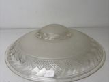 a clear glass lid on a white counter top