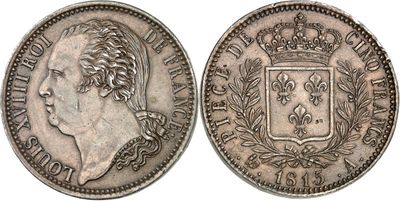 a silver coin with a crown on the front and a crown on the back