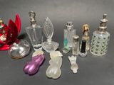 a lot of glass bottles that are sitting on a table