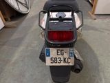 a motorcycle with a license plate on the back of it