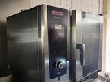 two large stainless steel ovens in a commercial kitchen
