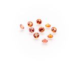 a group of orange sapphires on a white background