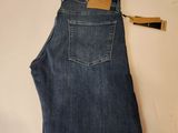 the back of a pair of jeans hanging on a hanger