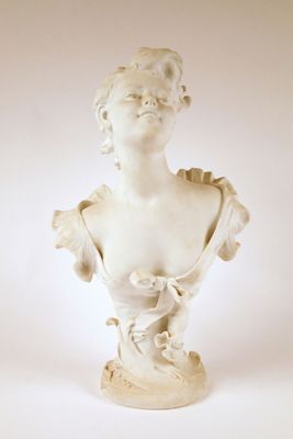 marble bust of a woman in a dress on a white background