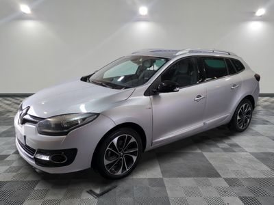 the white car is parked on a checkered tile floor