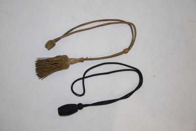 two different types of hair ties on a white surface