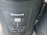 a close up view of a honeywell air purifier on the ground