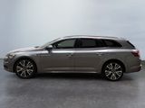 the grey car is parked on the concrete floor in the room