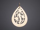 a gold tear shaped pendant with a floral design on it