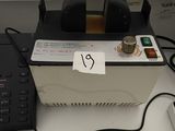 a laptop computer sitting on top of a desk next to a keyboard
