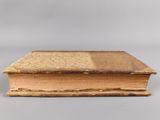 an old book that is sitting on a table