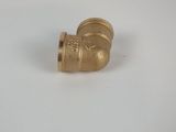 a close up of a brass pipe on a white surface